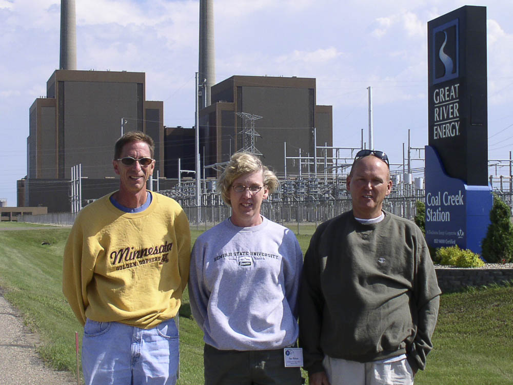teachers in front of power plant