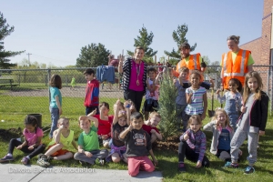 school children planting trees