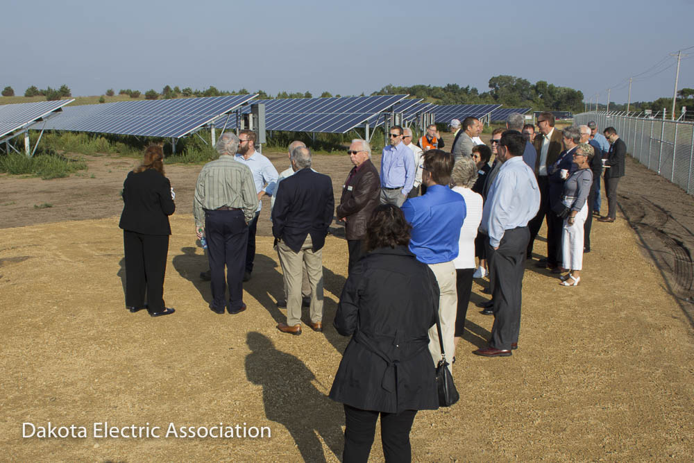 Dedication attendees viewing the solar panels.