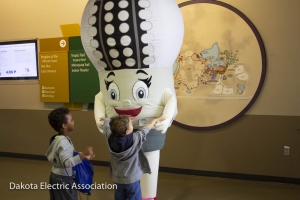 LED Lucy greeting children.