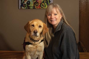 Linda Ball, founder and executive director of PawPADs, and Tory, the organization's ambassador dog.