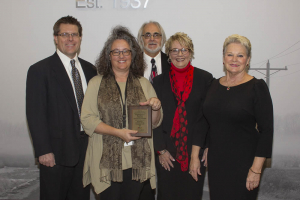 group with award plaque