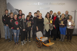 group showing off award plaques