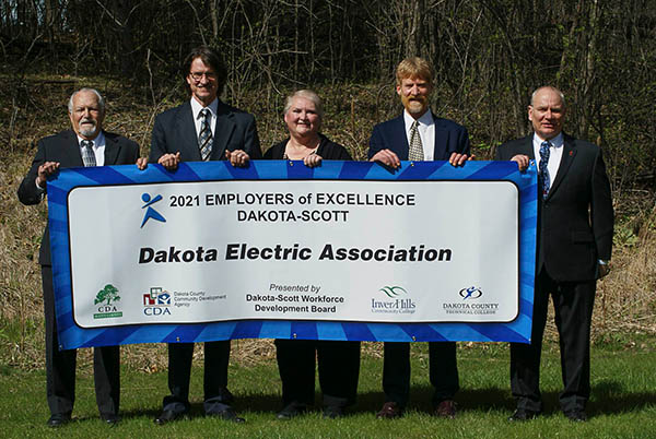 people holding award banner