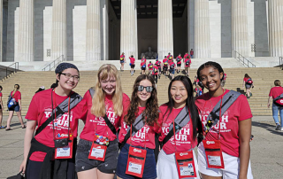 five girls in front of lincoln memorial