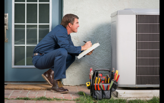 man looking at an AC unit