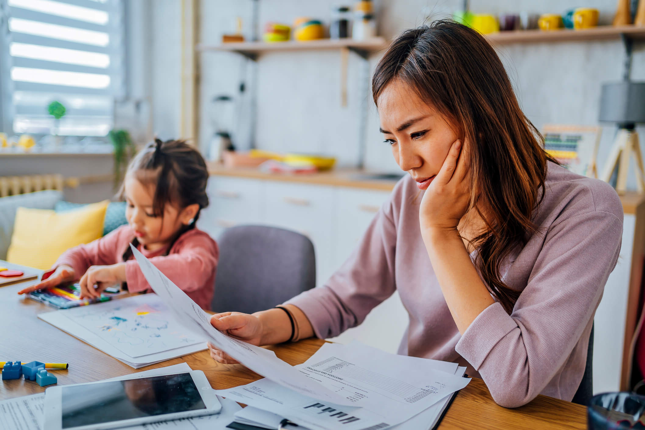 Mom paying bills